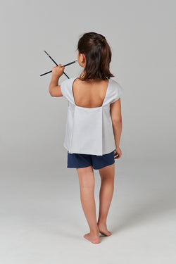 Blouse with back pleat.